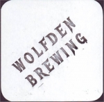 beer coaster from Woodstock Brewing and Bottling ( IL-WOLF-3 )