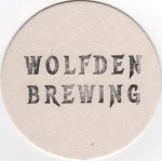 beer coaster from Woodstock Brewing and Bottling ( IL-WOLF-4 )